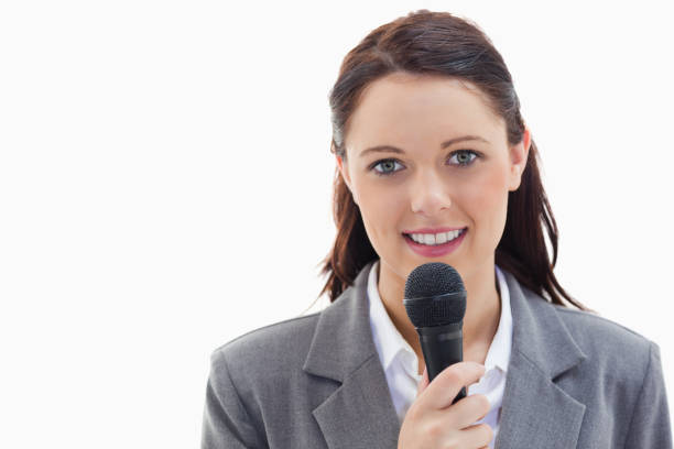 istock Businesswoman holding a microphone 824666628
