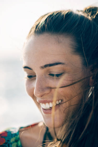 istock Young smiling girl at the beach 824674042