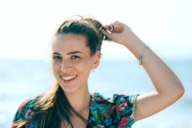 istock Young smiling girl at the beach 824674044