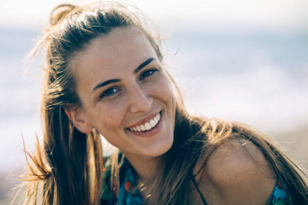 istock Young smiling girl at the beach 824674364