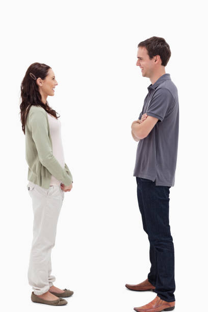 istock Couple standing face to face are laughing 824683288
