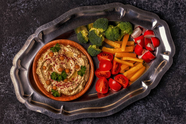 istock Classic hummus with vegetables on the plate and pita bread. 824683734