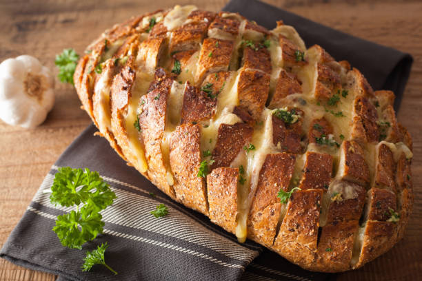 baked party bread with melted cheese butter herbs - home made bread imagens e fotografias de stock