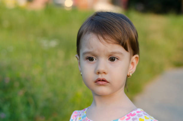 istock Small angel beauty with sparkling sunset in her eyes 824694090