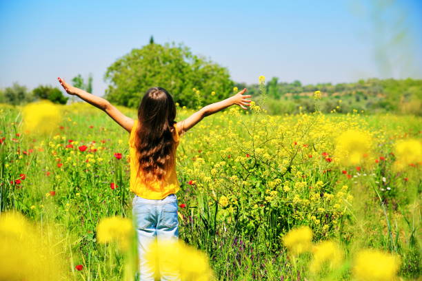 istock Girl in meadow 824697072