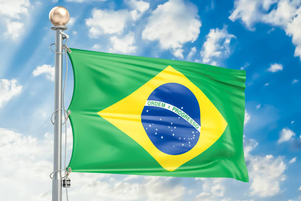 istock Brazilian flag waving in blue cloudy sky, 3D rendering 824697310