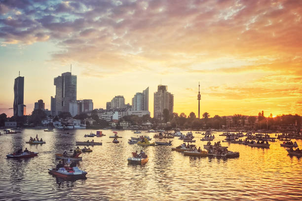 Rental pedalo and sailing boats in Vienna, Austria Rental pedalo boats in Vienna, Austria during sunset in summer pedal boat stock pictures, royalty-free photos & images