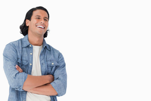 istock A man laughing and crossing his arms 824709456