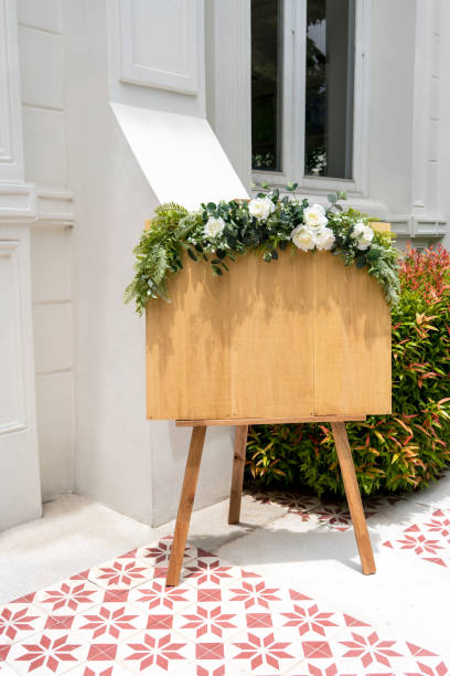 istock Blank classic wood signage stands decorated with flowers 824713130