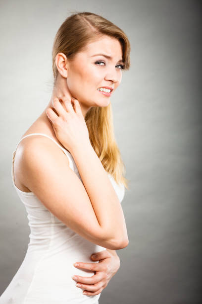 istock woman scratching her itchy neck with allergy rash 824713214