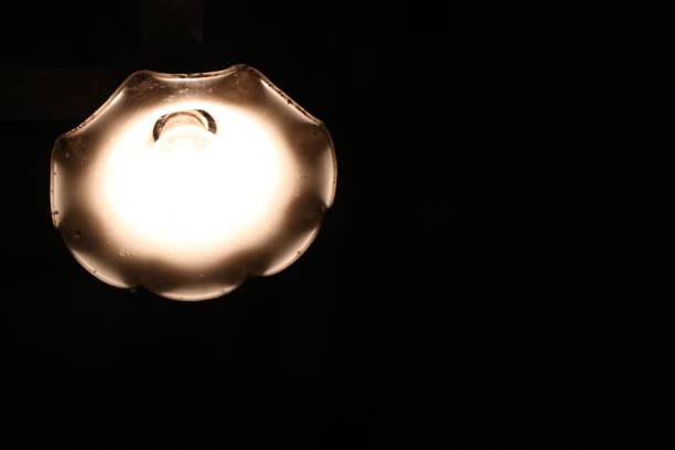 istock Lantern electric lamp vintage light style interior at home on black background 824713294