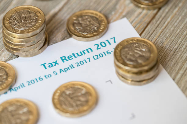 istock New 2017 One pound Coins on UK tax Return 824713896