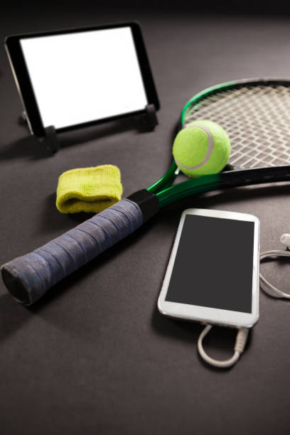istock High angle view of technologies and tennis equipment 824715926