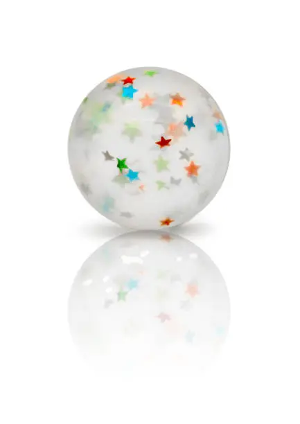 Photo of Transparent rubber ball with colorful stars inside isolated on white background