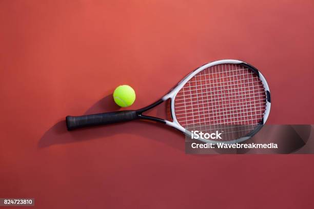 Overhead View Of Fluorescent Yellow Tennis Ball On Racket Stock Photo - Download Image Now