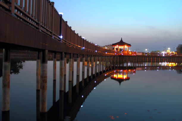 istock Wood deck On the lake in park 824724108