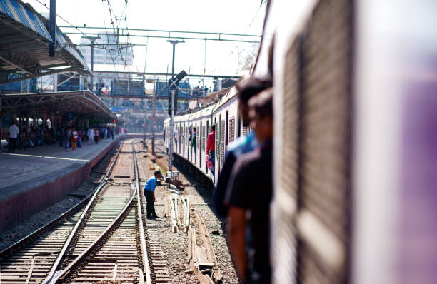 Mumbai, India -January 28, 2017 : A lot of passengers stood at the train door and the door was opened. Every day about 3 to 4 millions passengers pass through the station.