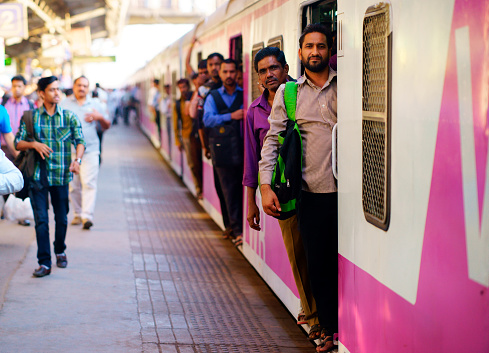Mumbai, India -January 28, 2017 : A lot of passengers stood at the train door and the door was opened. Every day about 3 to 4 millions passengers pass through the station.