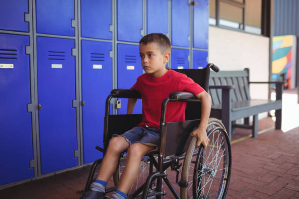 istock Thoughtful boy sitting on wheelchair 824730272