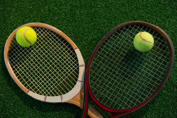 istock Overhead view of tennis balls on rackets 824733868