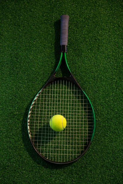 istock Overhead view of racket with tennis ball 824734136