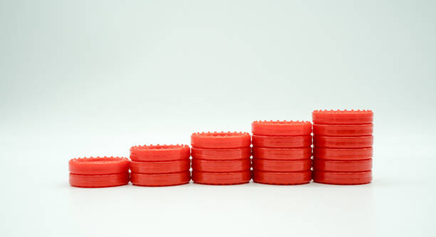 istock Row of coin rising stacks isolated on white 824737122
