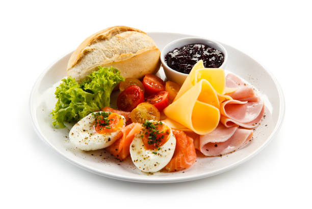 Breakfast - boiled egg, smoked salmon, cheese, ham and vegetables