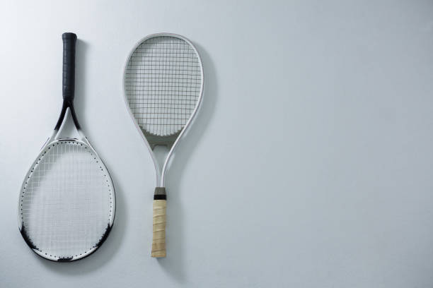 istock Overhead view of metallic tennis rackets 824743808