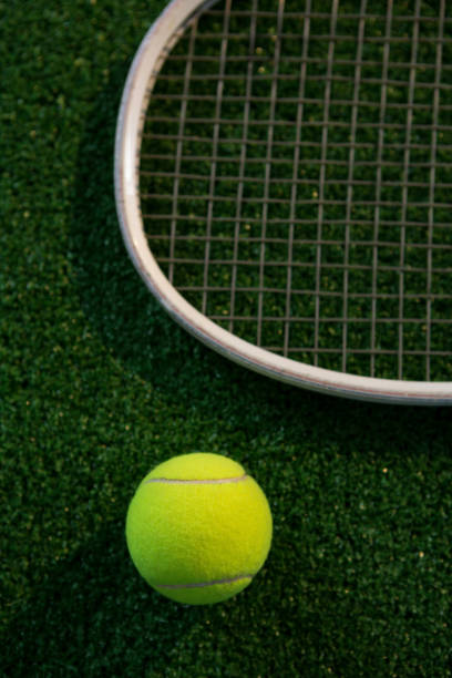 istock Cropped image of racket by tennis ball 824743900