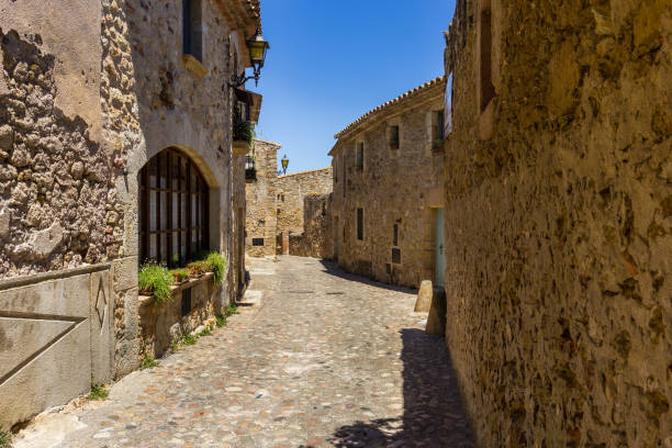 istock Narrow stone walkway in Pals, Spain 824750448
