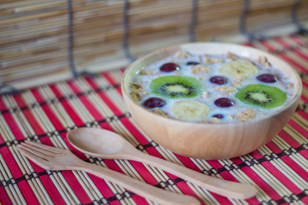 istock breakfast cereals with fruit, oats and yogurt in bowl. 824760474