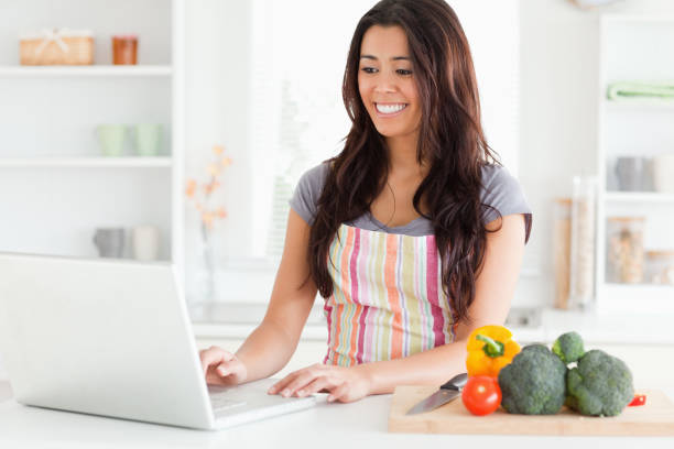 istock Gorgeous woman relaxing with her laptop while standing 824763756