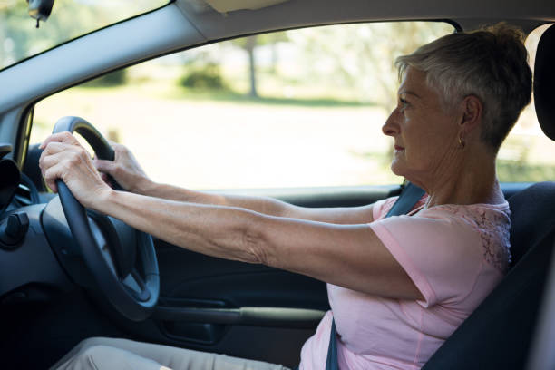 istock Senior woman driving a car 824767092