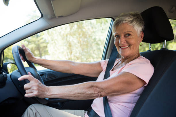istock Active senior woman driving a car 824767176