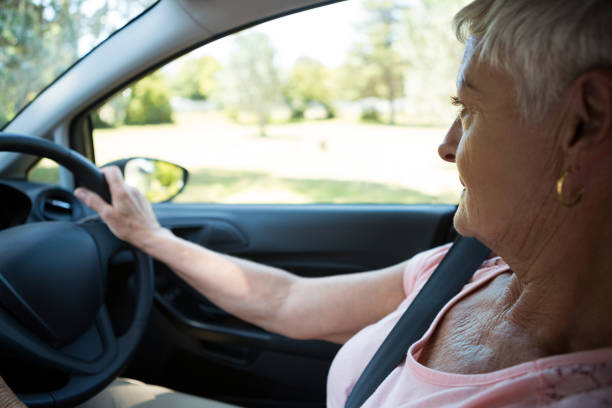 istock Senior woman driving a car 824767204