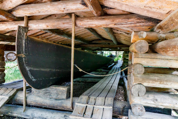 istock Ancient boat house made of tree logs 824773696