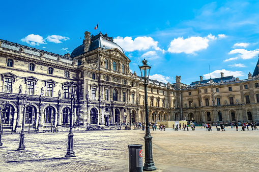 Paris, France - MAY 27, 2015: The Louvre in Paris on a sunny day with blue sky. Tourists go around the pyramid of the Louvre and stand in line to enter the museum. Pencil old retro style photo.