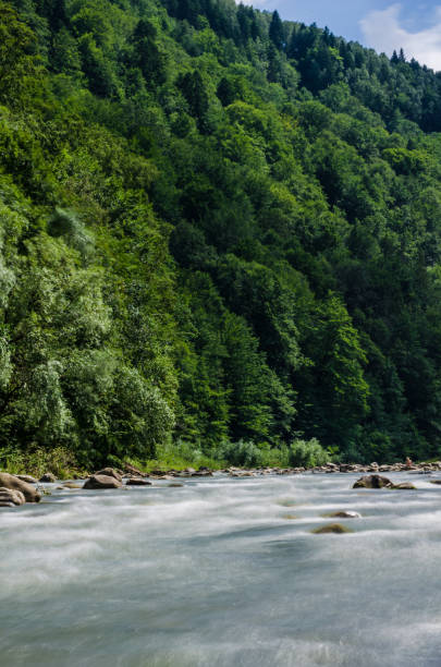 istock background landscape with waterfall in Yaremche vilage in Ukraine 824779018