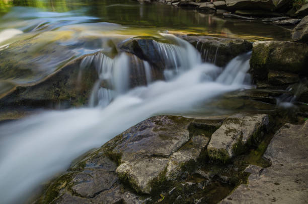 istock background landscape with waterfall in Yaremche vilage in Ukraine 824780842