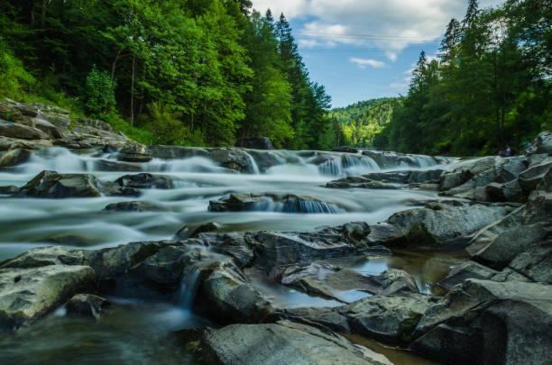 istock background landscape with waterfall in Yaremche vilage in Ukraine 824780872