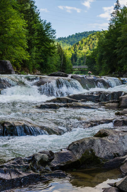 istock background landscape with waterfall in Yaremche vilage in Ukraine 824780886
