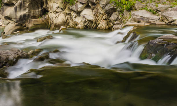istock background landscape with waterfall in Yaremche vilage in Ukraine 824781288