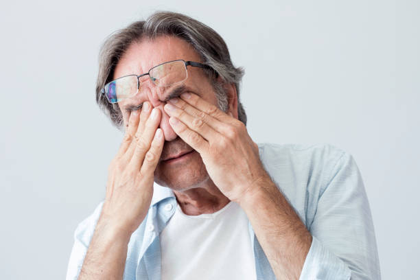 istock Old man with eye fatigue 824781962