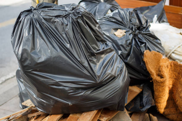 istock Black plastic garbage bags in the park. 824785686