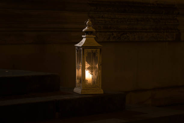 istock The old lantern with candle on stone step of stairs 824788178
