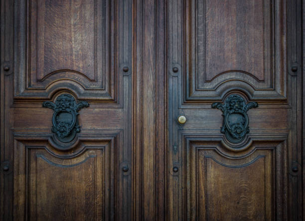 istock The old door knocker on a wooden door 824788320