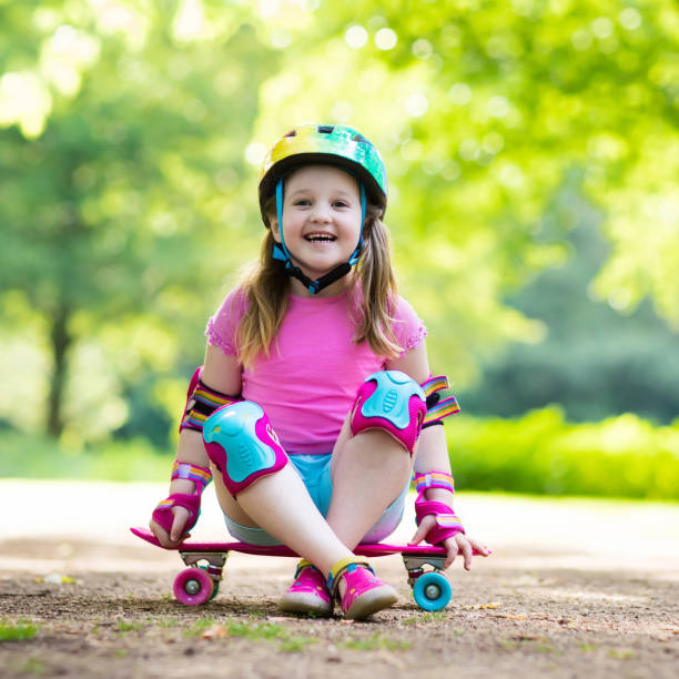 istock Child riding skateboard in summer park 824793942