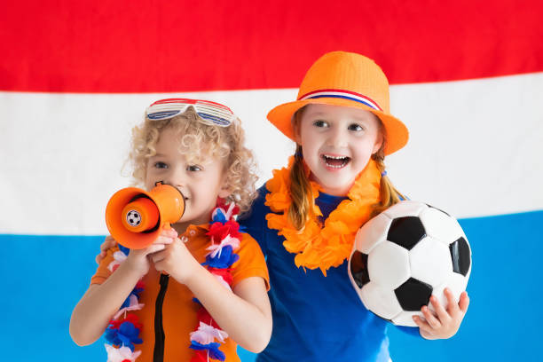istock Kids supporting Netherlands football team 824800426