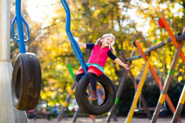 istock Child on playground in autumn. Kids in fall. 824800870