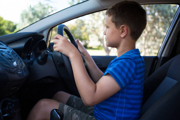 istock Teenage boy driving a car 824801722